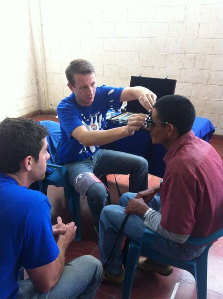 "I'm performing a trial frame refraction on a patient in El Salvador. We saw nearly 18 patients over 5 days in rural villages."
