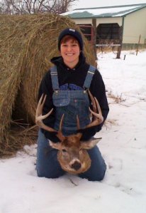 "Yes, those are bib-overalls, and yes that is a deer head. And yes, I am smiling about it, mostly because I know how ridiculous this picture is, especially with the hay bale in the background."