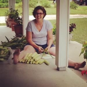 "This is one of my favorite pictures of my mom. A typical day at home involves picking corn from our garden, and me reading on the front porch on our swing."