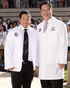 Michael at his White Coat ceremony with Dean Woo