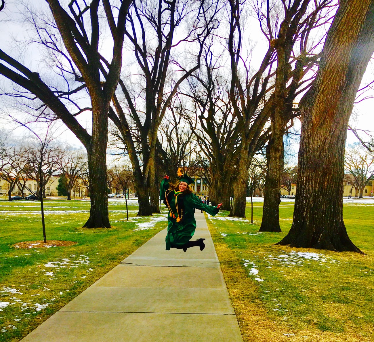 A picture of me jumping for joy because I graduated college!!
